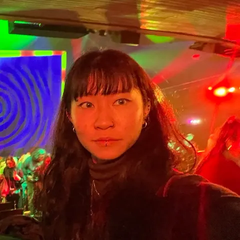 In a room washed in neon colour