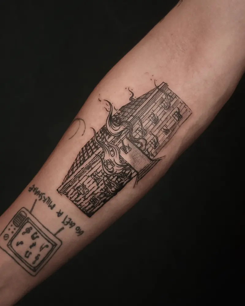 Tattoo work: a narrow shophouse, on a forearm