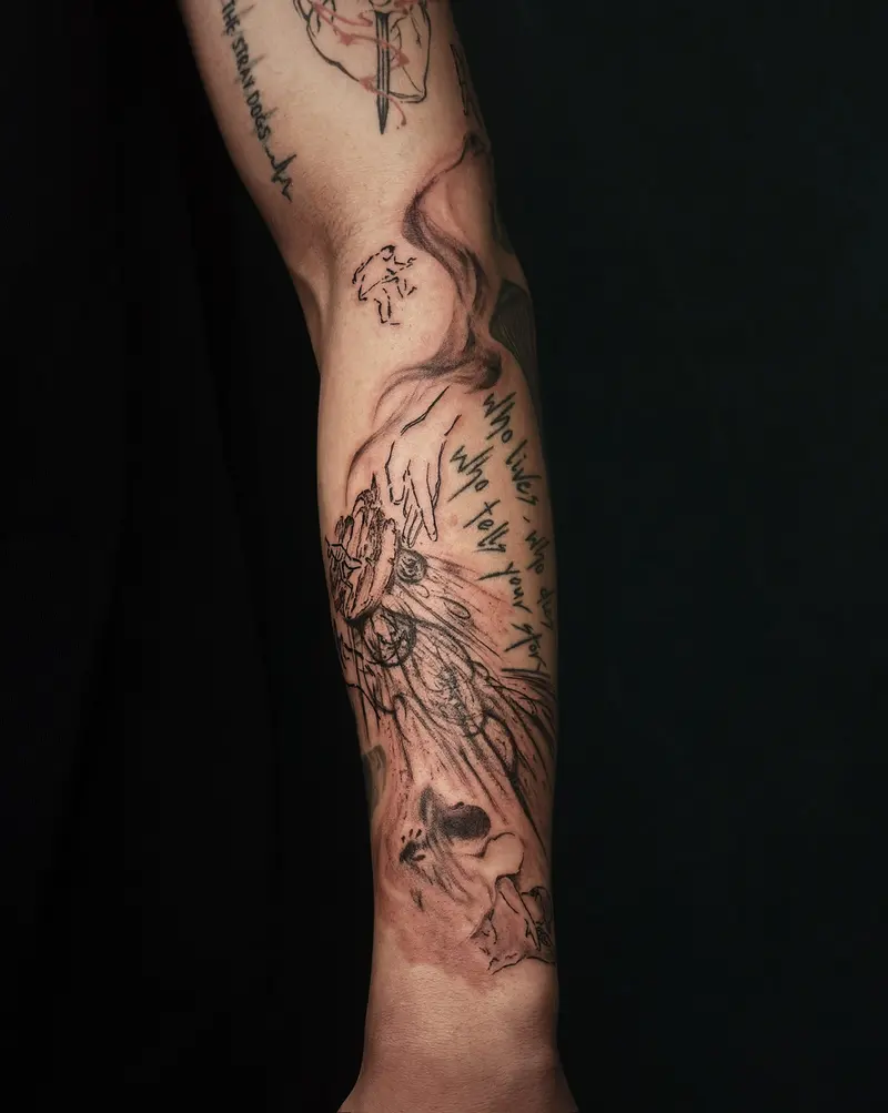 Tattoo work: a fine line botanical trailing down a forearm
