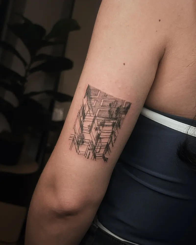 Tattoo work: a small block of architecture, on the side of a torso