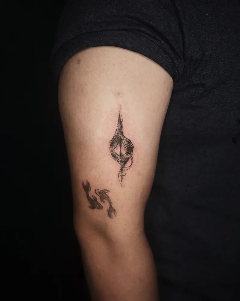 Tattoo work: a small seed pod, on an inner arm