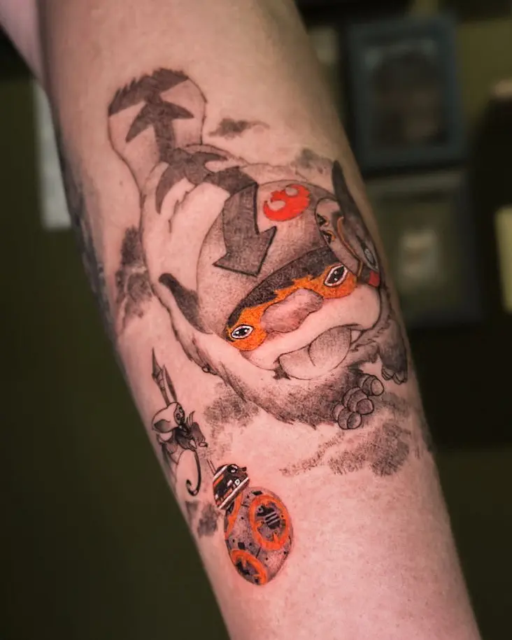 Tattoo work: mushrooms, ladybirds and koi in colour, on a forearm